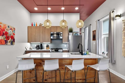 Kitchen: Fully equipped kitchen with modern appliances, cookware, and essentials for preparing anything from a quick breakfast to a family dinner during your stay.