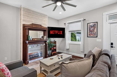 Living Room: Relax in this bright and inviting living room featuring comfortable seating, stylish décor, and plenty of natural light. The perfect place to unwind after a day of exploring.
