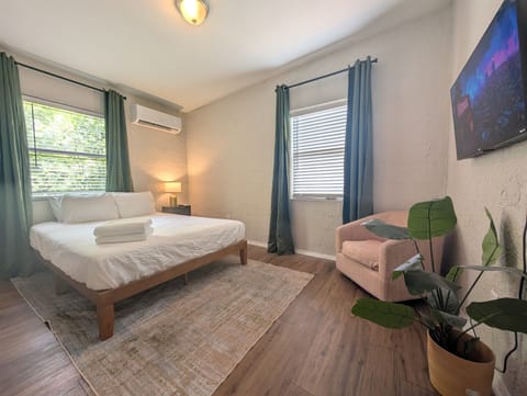 Guest room with TV and chair