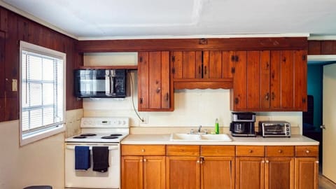 Kitchen with stove, microwave, coffee maker, and toaster oven