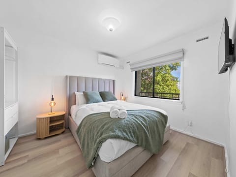A bright and airy bedroom that feels instantly welcoming.