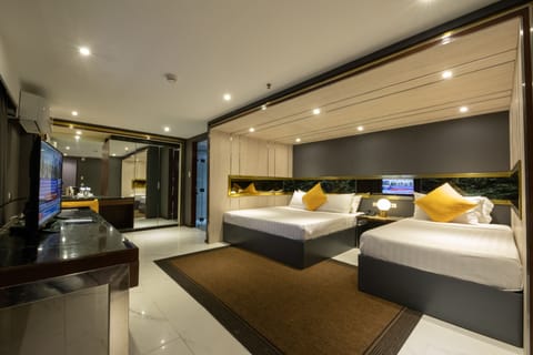 Family Triple Room | Desk, blackout drapes, WiFi (free), bed sheets