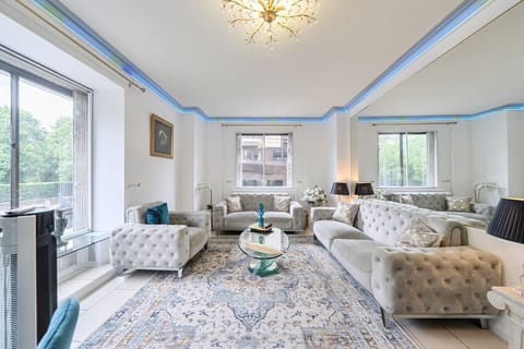Elegant lounge with plush velvet sofas and bright leafy outlooks.