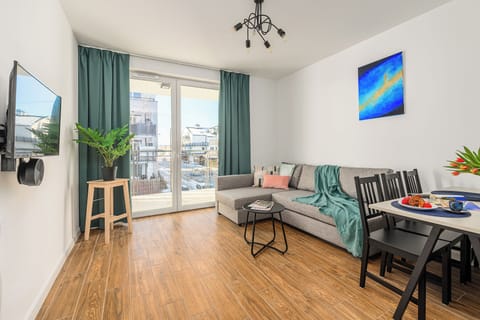 Family Apartment, Balcony, Courtyard View | Living area | Flat-screen TV