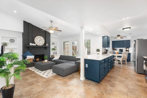 Open living room with fireplace and stylish decor.