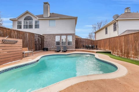 Spacious backyard pool offering a refreshing escape, with comfortable outdoor space designed for family and group stays.