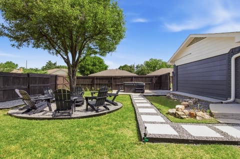 Backyard Fire Pit lounge with paver path leading from the patio, surrounded by Adirondack seating. Roast marshmallows, share stories, and soak up the Frisco evenings.