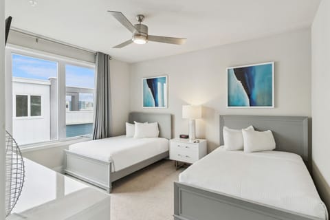 Twin bedroom upstairs featuring two separate beds — perfect for kids or friends
