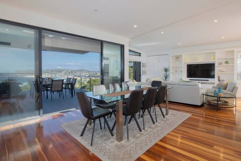The spacious dining area features sleek contemporary styling and an inviting layout, making it ideal for both relaxed family meals and effortless entertaining.