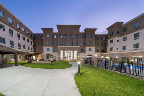 Stroll through the beautifully landscaped courtyard, where relaxation meets elegance.