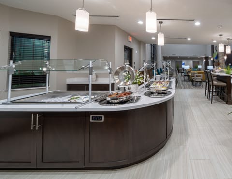 Indulge in a variety of breakfast offerings displayed beautifully in a welcoming setting.