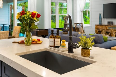 View from the Living Room: Look across the open-concept layout into the stunning kitchen, highlighting a home designed for effortless entertaining.