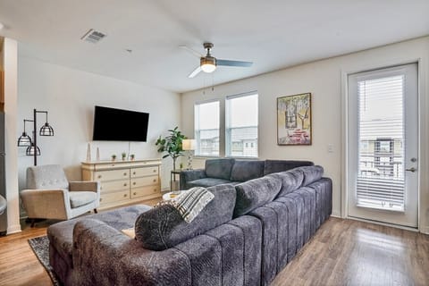 Spacious, comfy living room with 65` smart TV