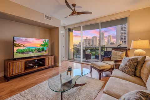 Stunning open-concept living room featuring floor-to-ceiling windows and panoramic city views.