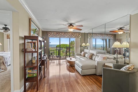 Spacious Living Room with Balcony Access and Gulf Views