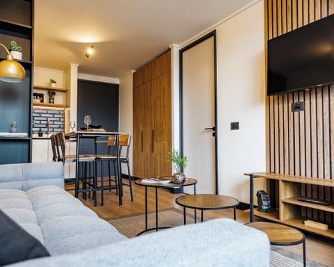 Cozy and modern living area with stylish decor, perfect for relaxing and dining in comfort.