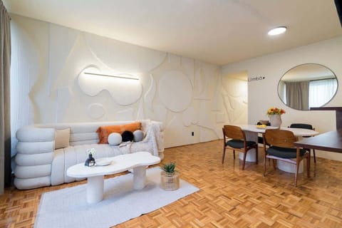Relax in our cozy, modern, and well illuminated living room. Enjoy your favorite shows on the TV with standard cable and Netflix. The perfect space to kick back and enjoy some downtime! 