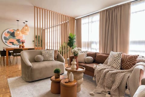 Thoughtfully curated seating area with soft textures, earthy tones, and an open layout that feels both stylish and inviting. Perfect for enjoying coffee, reading, or spending quality time together.