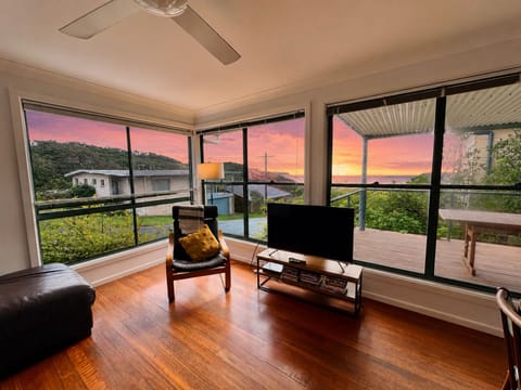 Living room looking out towards end of street and ocean view