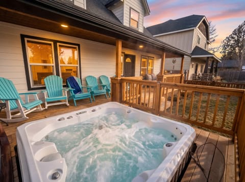 Outdoor Oasis: Relax in the hot tub while enjoying stunning sunset views from the spacious deck!