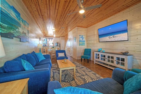 Bright, beachy living room with plenty of seating for relaxing after pool days and coastal adventures.