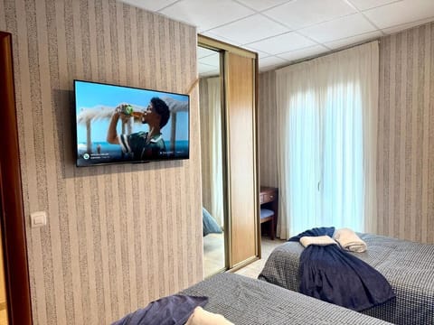 Triple Room, Balcony, City View | Iron/ironing board, free WiFi, wheelchair access