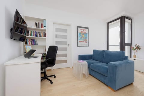Relax in the stylish living room with a comfortable sofa and modern decor.