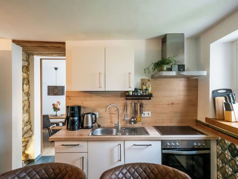 Furniture, Countertop, Interior Design, Kitchen, Wall, Kitchen Appliance, Wood, Flooring, Cabinetry, Major Appliance