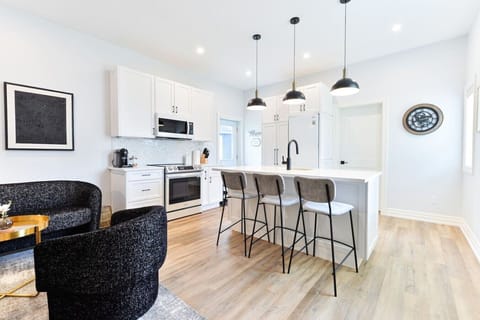 Gather around the kitchen island, perfect for morning coffee, casual dining, or planning your day in beautiful Perth. Your private apartment entrance is just steps away.