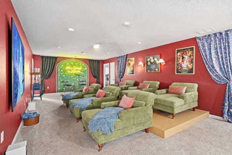 Themed movie theatre with colorful beds and storybook wall art