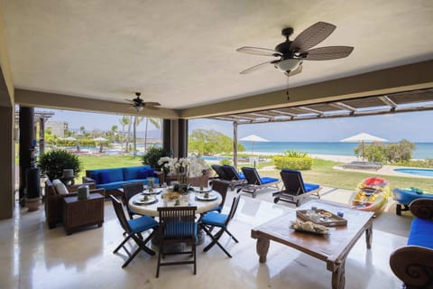 Spacious oceanview terrace with outdoor dining, lounge seating, and seamless indoor-outdoor living perfect for entertaining and relaxing.