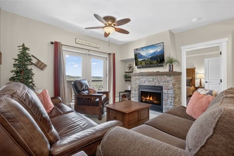 Relax in our living area with comfy seating, gas fireplace, TV, and games.