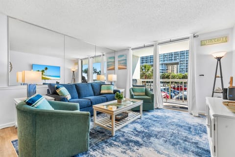 Large Living room area with balcony access and sleeper sofa