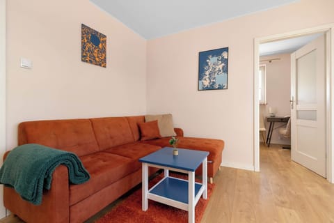 Relax in the stylish living room with a comfortable sofa and cosy decor.