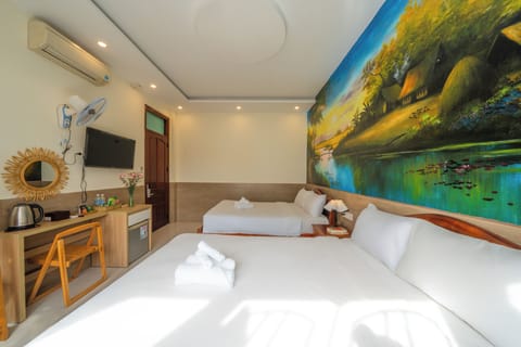 Standard Quadruple Room, Non Smoking, Garden View | Minibar, free WiFi, bed sheets