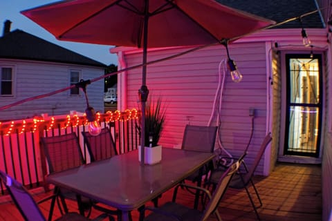 Patio in backyard with umbrella for shade