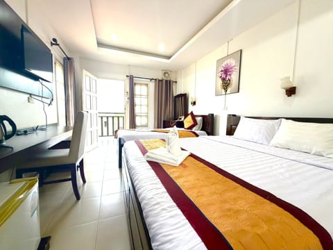 Standard Quadruple Room | In-room safe, desk, laptop workspace, soundproofing