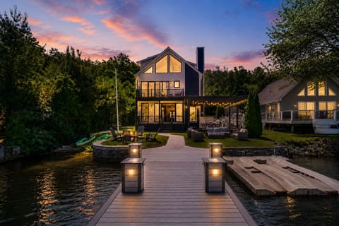 Luxury lakefront escape with private dock, fire pit, and sunset views on Greenwood Lake.