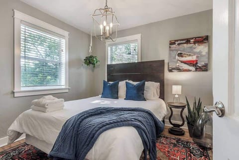 Charming Bedroom: Relax in style with vibrant decor and natural light streaming through!