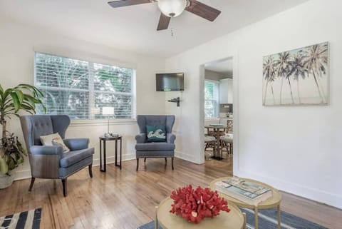 Living Room: Bright and inviting space with chic seating, tropical decor, and a touch of Florida charm!