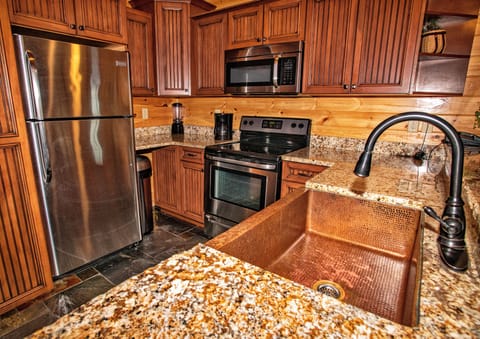 Microwave, coffee/tea maker, cleaning supplies, paper towels