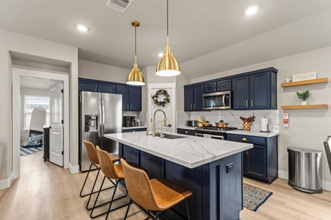 Kitchen Paradise: Sleek cabinetry and inviting island for culinary adventures!

