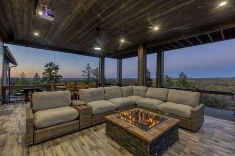 Expansive covered patio designed for year-round outdoor entertaining and relaxation.