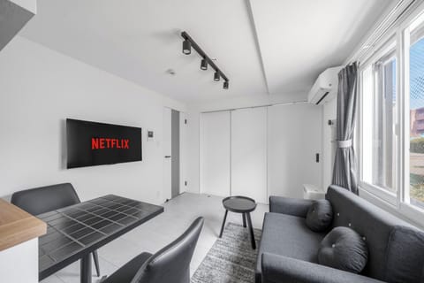 Apartment | Living area | 43-inch flat-screen TV with digital channels