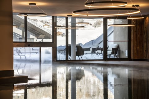 Indoor pool, seasonal outdoor pool, pool umbrellas, sun loungers