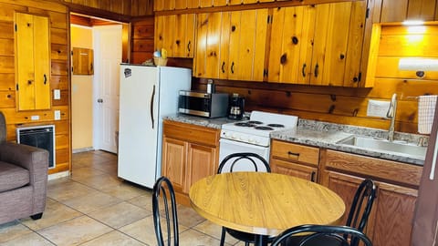 Standard Kitchenette Room with Two Queen Beds | Living area | 43-inch LED TV with cable channels, TV