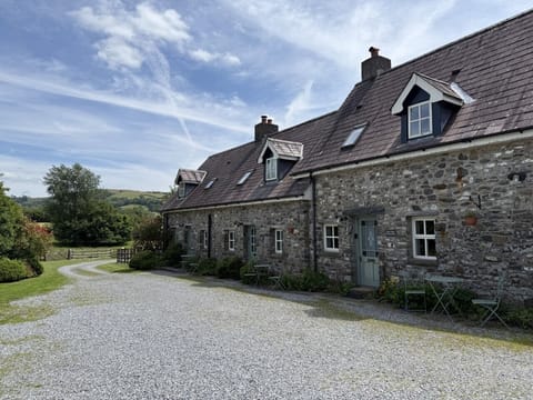 Buzzards cottage is the third cottage from the left hand side
