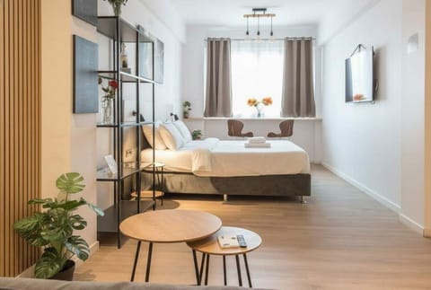 Ceiling fan, ambient lighting, and neutral palette create refreshing airflow and tranquil atmosphere throughout daytime.