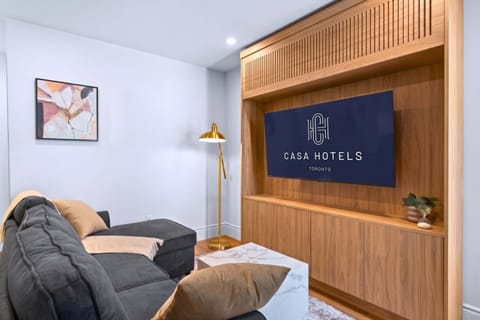 Stylish living space with Smart TV and sofa bed.
