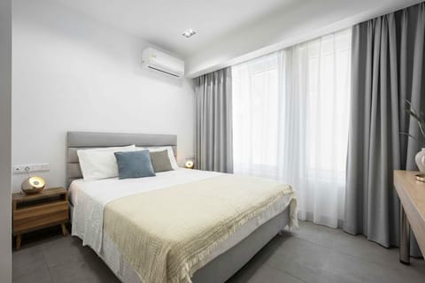 Balanced proportions, plush textures, and generous windows create an effortless retreat with a soothing urban rhythm.